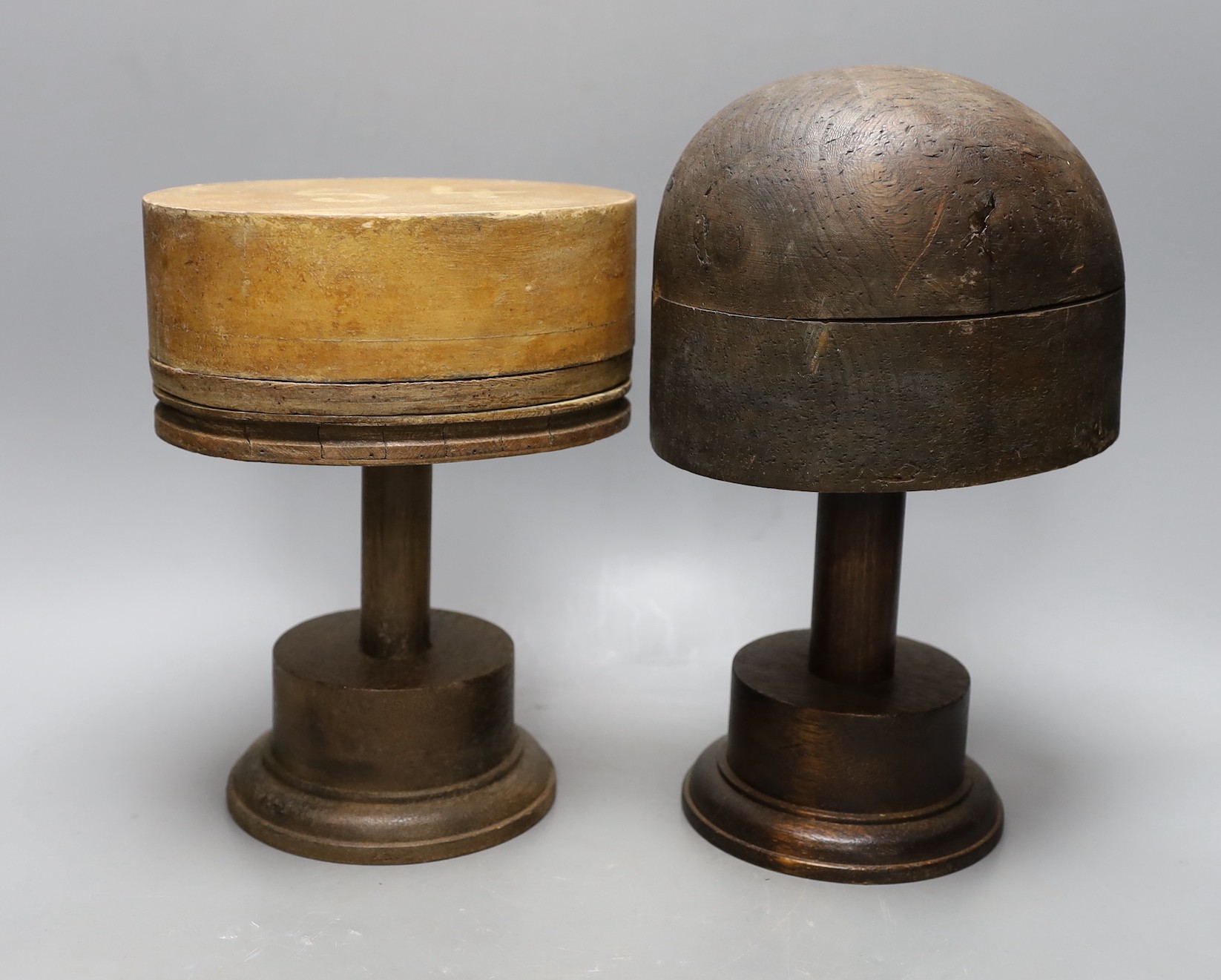 A World War One German beechwood helmet mould, 34cm wide, and five hatters’ blocks